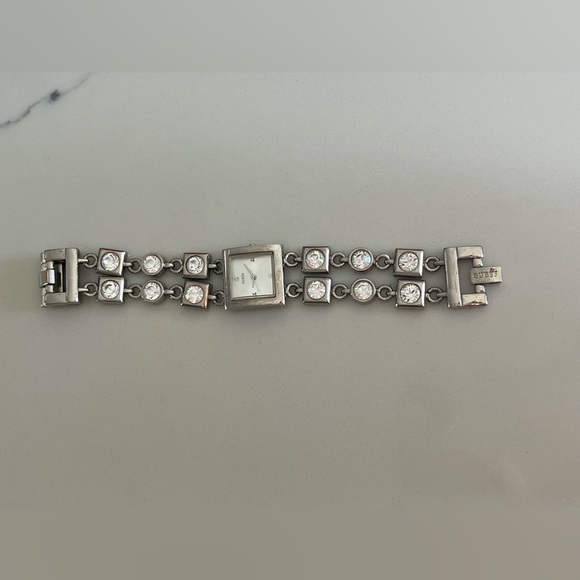 Guess women’s silver- tone bracelet watchwater resistant